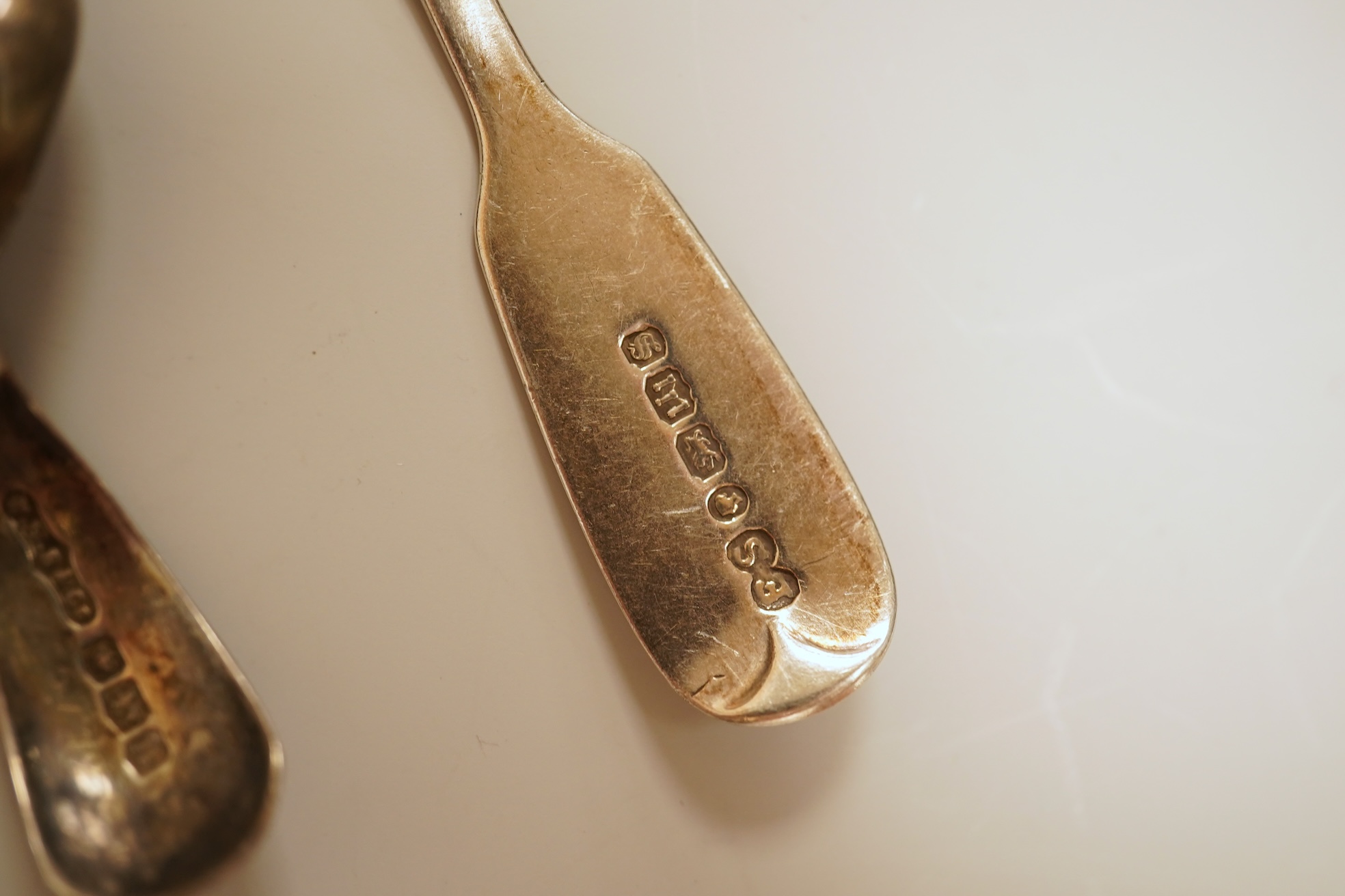 A small quantity of 18th century and later assorted silver teaspoons, various patterns, dates and makers, together with a George V silver pastry fork and two George V silver caddy spoons, 10.7oz.